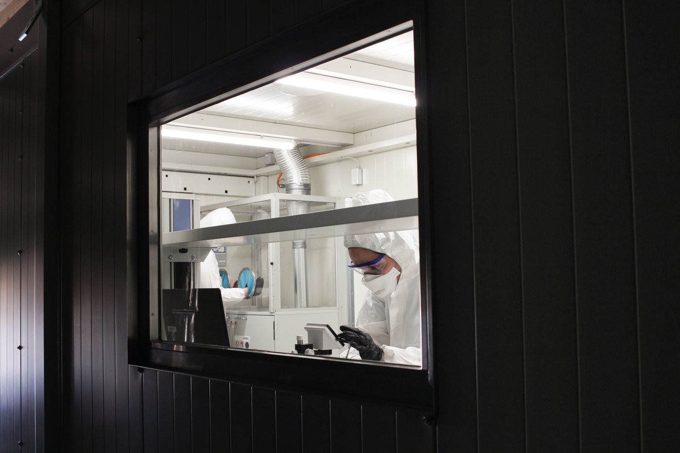 View through the inspection window of a container laboratory into the working area